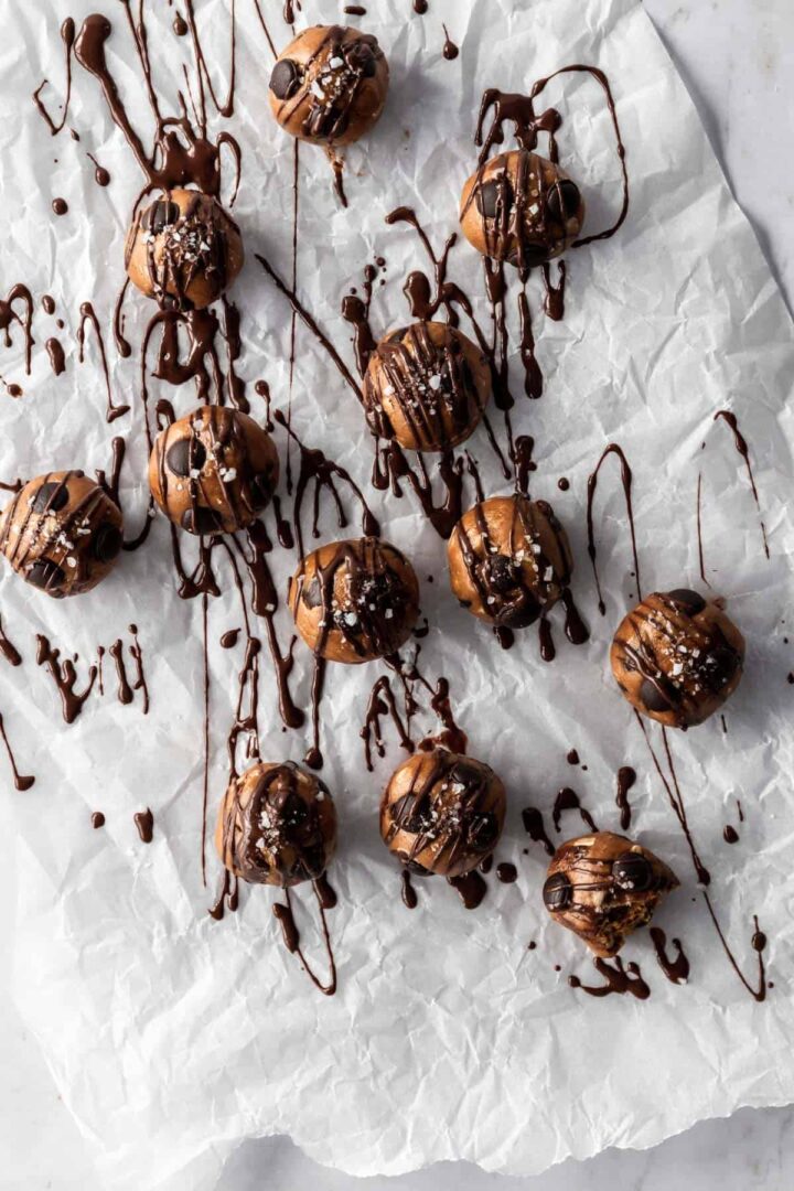 peanut butter balls sprinkled with salt and chocolate chips