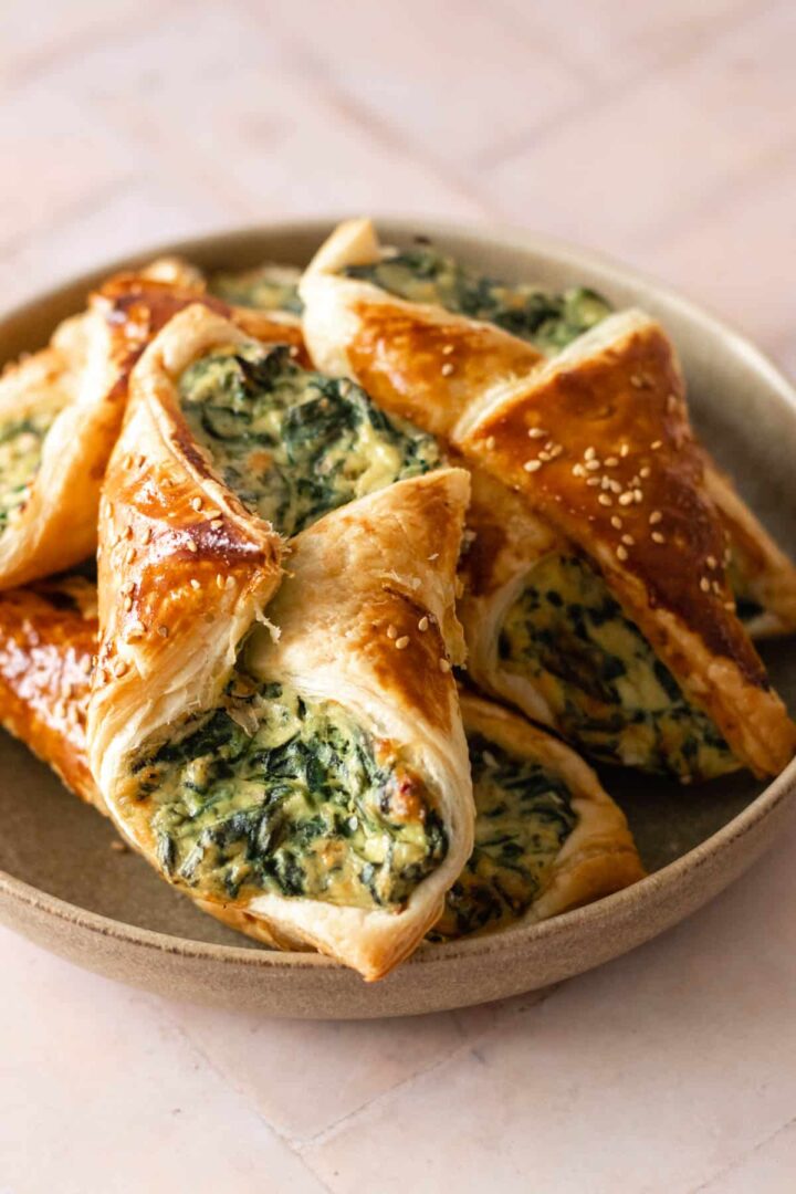close-up of a plate served with spinach puffs