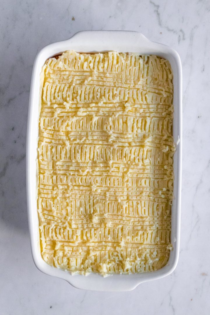 a baking dish with lentil Shepherd's pie before going to the oven