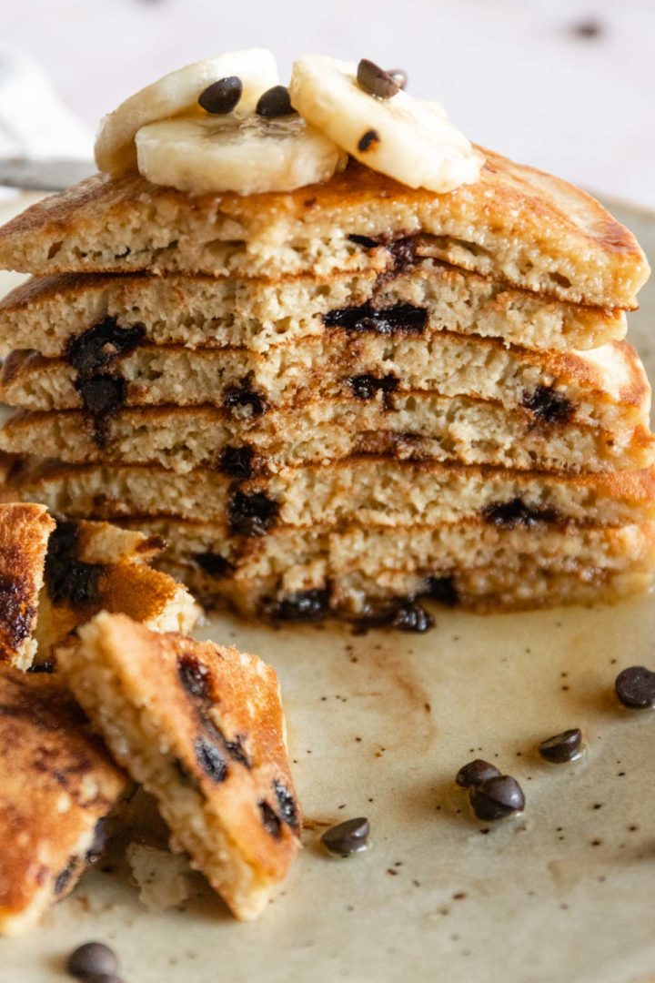 close-up of banana chocolate chip pancakes with banana slices and chocolate chips