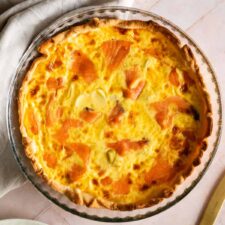 smoked salmon quiche on a glass baking dish