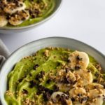 green smoothie bowl with banana, peanut crumble and cacau nibs