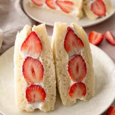 two whipped cream strawberry sandwiches