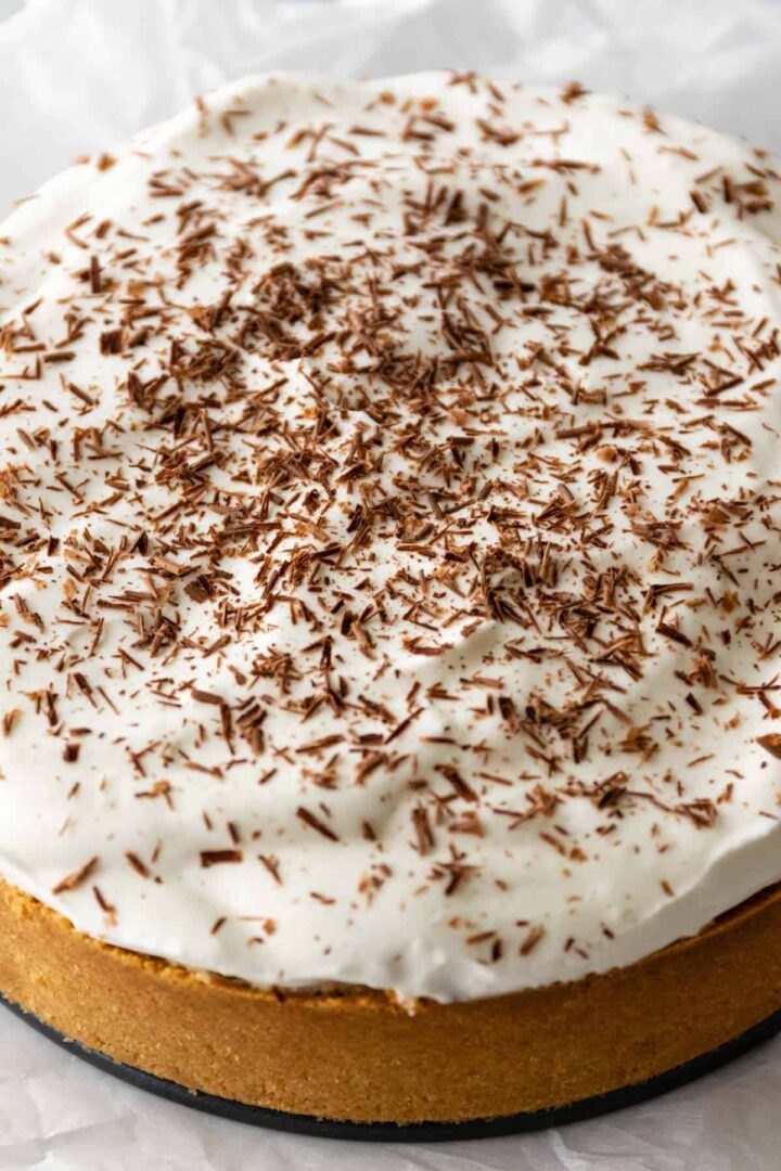 close up of a banoffee pie garnished with chocolate shavings