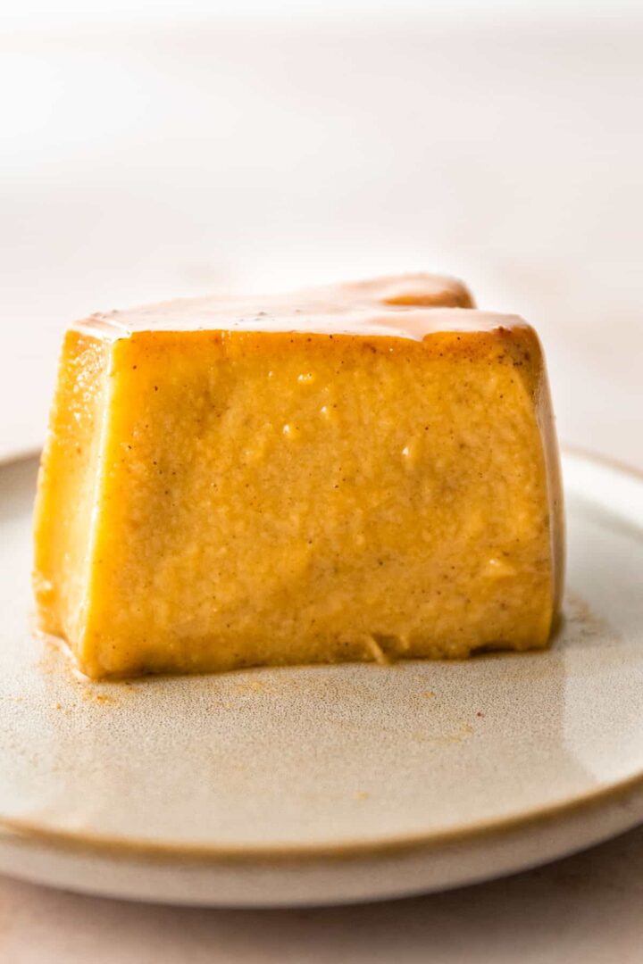 a small plate with a pumpkin flan on it