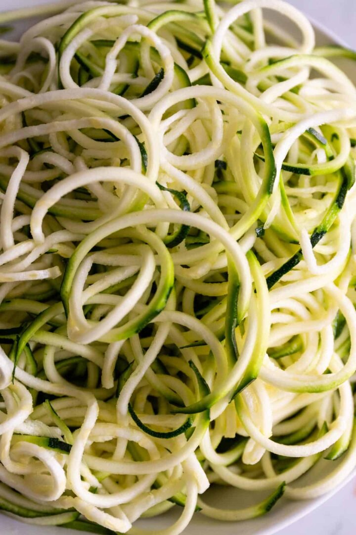close up of one bowl with zucchini noodles