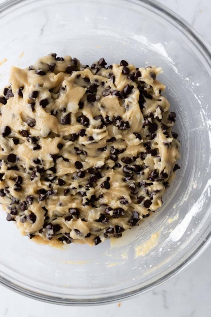 one glass bowl with cookie dough and chocolate chips