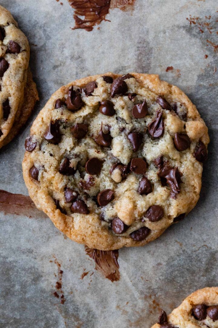close up to a cookie with melted chocolate chips