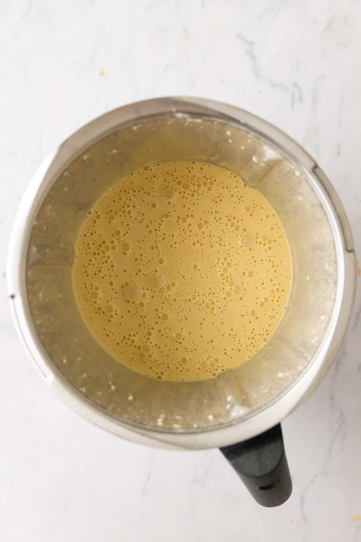 crepe batter inside the thermomix bowl after being blender