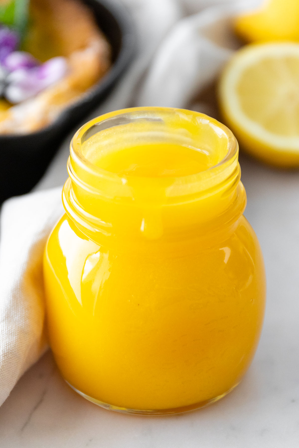 a small glass jar with lemon curd